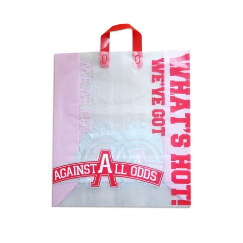 Side view of a red reusable soft loop shopping bag showing expandable gusset for large items.