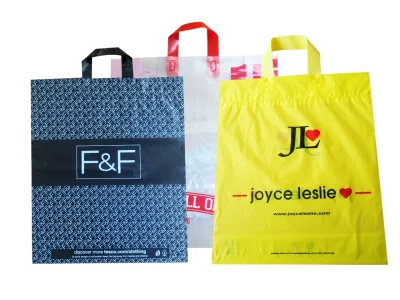 A collection of colorful reusable soft loop shopping bags for wholesale custom orders.