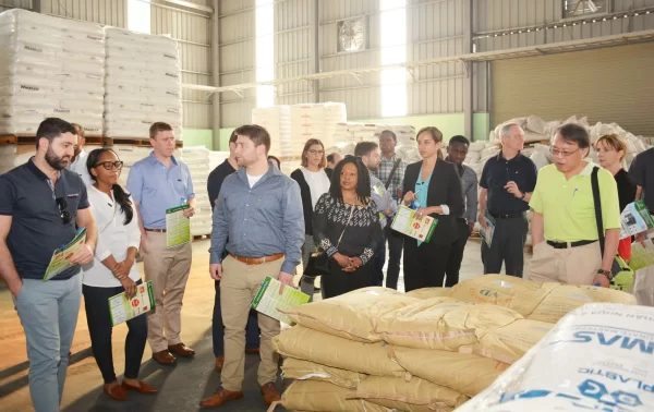 University of Connecticut delegation visiting Hanoi Plastic Bag factory and inspecting raw materials