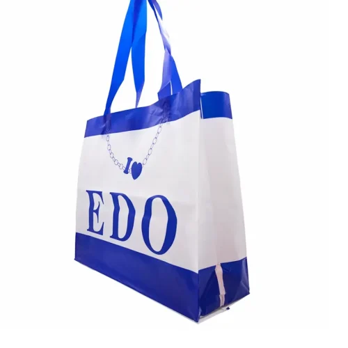 Side view of a durable plastic soft loop shopping bag showing gusset expansion