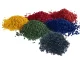 Multiple colors of PE plastic pellets including red, yellow, green, blue, and black
